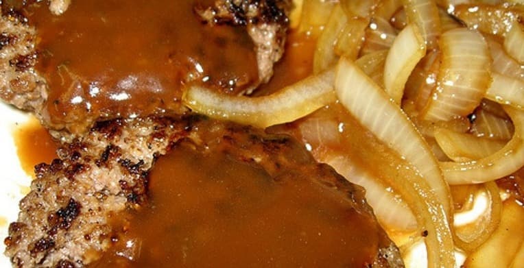 Cover Image for Sultry, Satisfying, Savory Hamburger Steaks Entangled In A Seductive Web Of Caramelized Onions Over Bread
